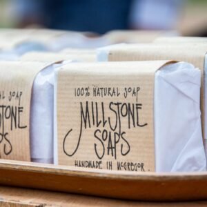 Close-up of handmade Millstone Soaps packaging showcasing natural and organic design.